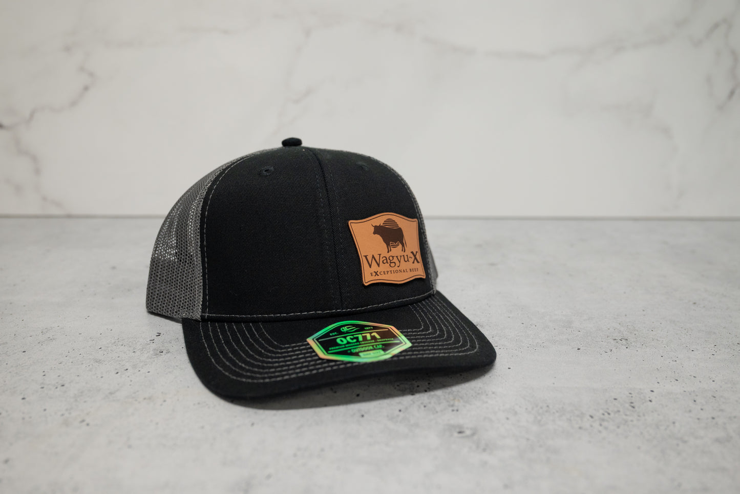 Wagyu-X Trucker Hat — Black / Charcoal Leather Patch