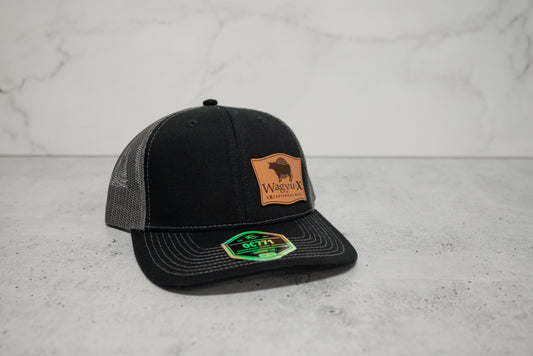 Wagyu-X Trucker Hat — Black / Charcoal Leather Patch